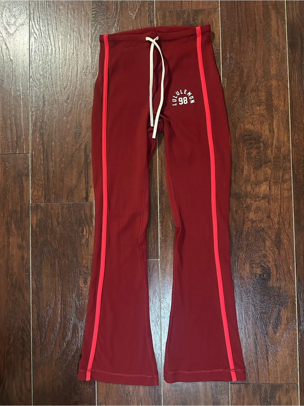 Lululemon Nulu Sporty Trim Size 2 Mid-Rise
Flared Pant Oxblood/ Lululemon Red